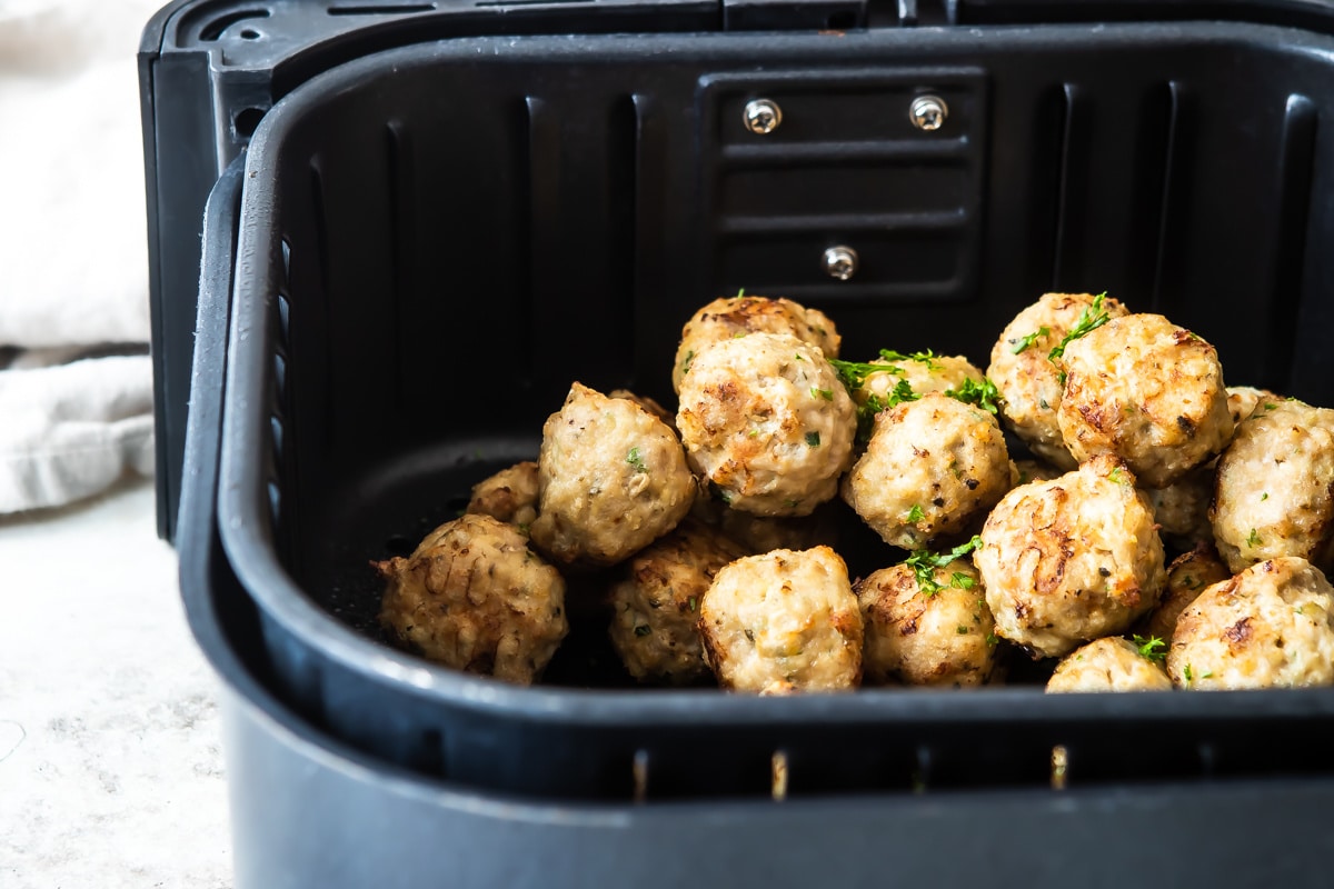 Air Fryer Meatballs in an air fryer basket.