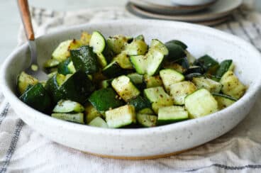 Air fryer zucchini in a bowl.