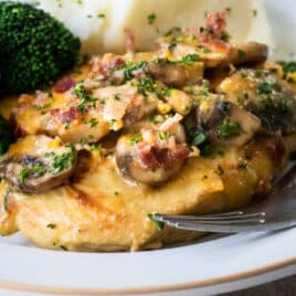 Alice Springs chicken on a plate with broccoli.
