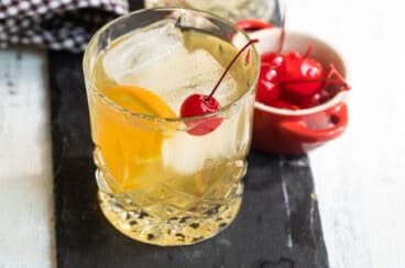 An amaretto sour cocktail in a clear glass.