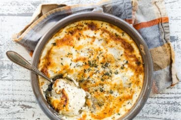 A baking dish full of Au Gratin potatoes.