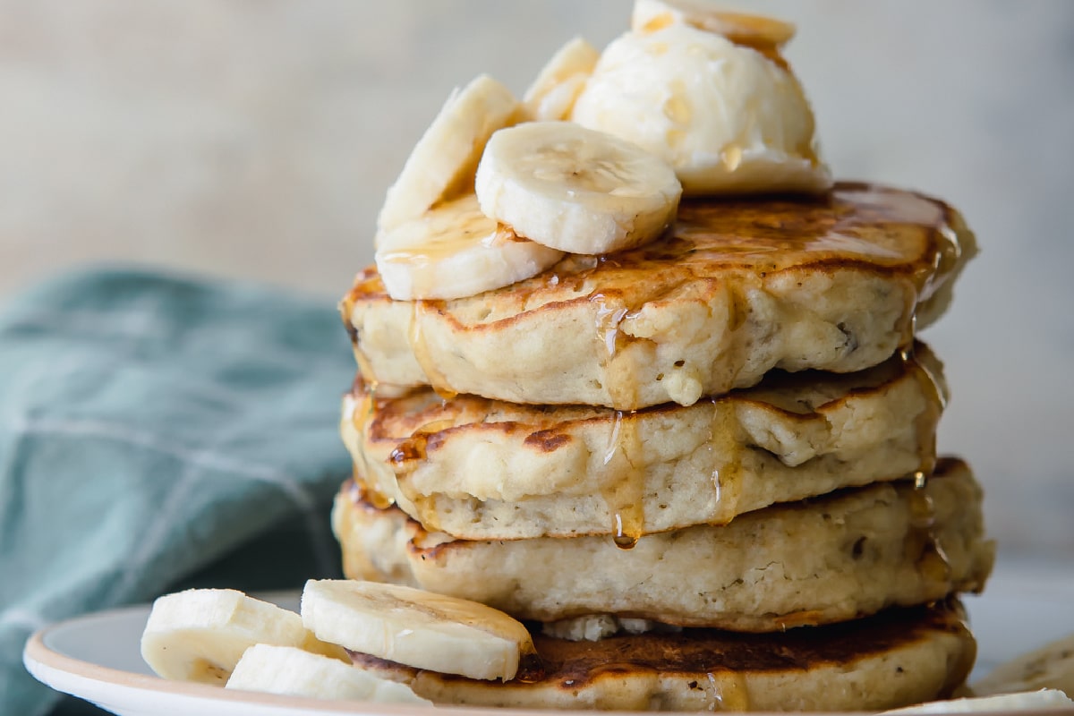 A stack of banana pancakes on a plate.