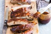 Barbecue ribs on a wood cutting board.