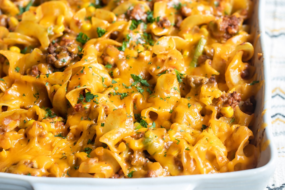 Beef noodle casserole in a white baking dish.
