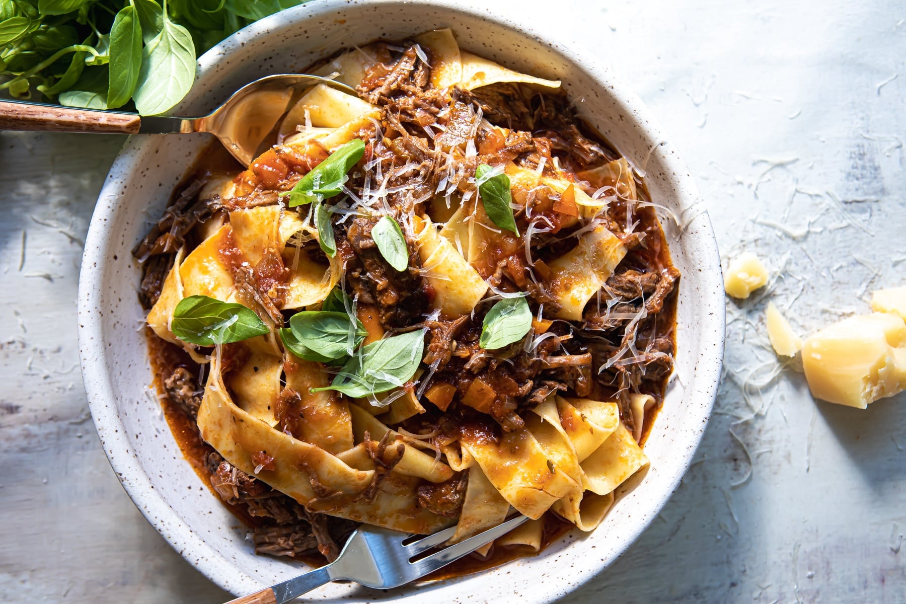 Beef ragu in a gray bowl.