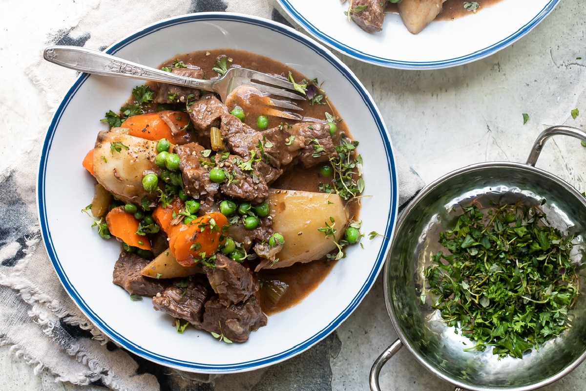 Bowls of beef stew on a table.