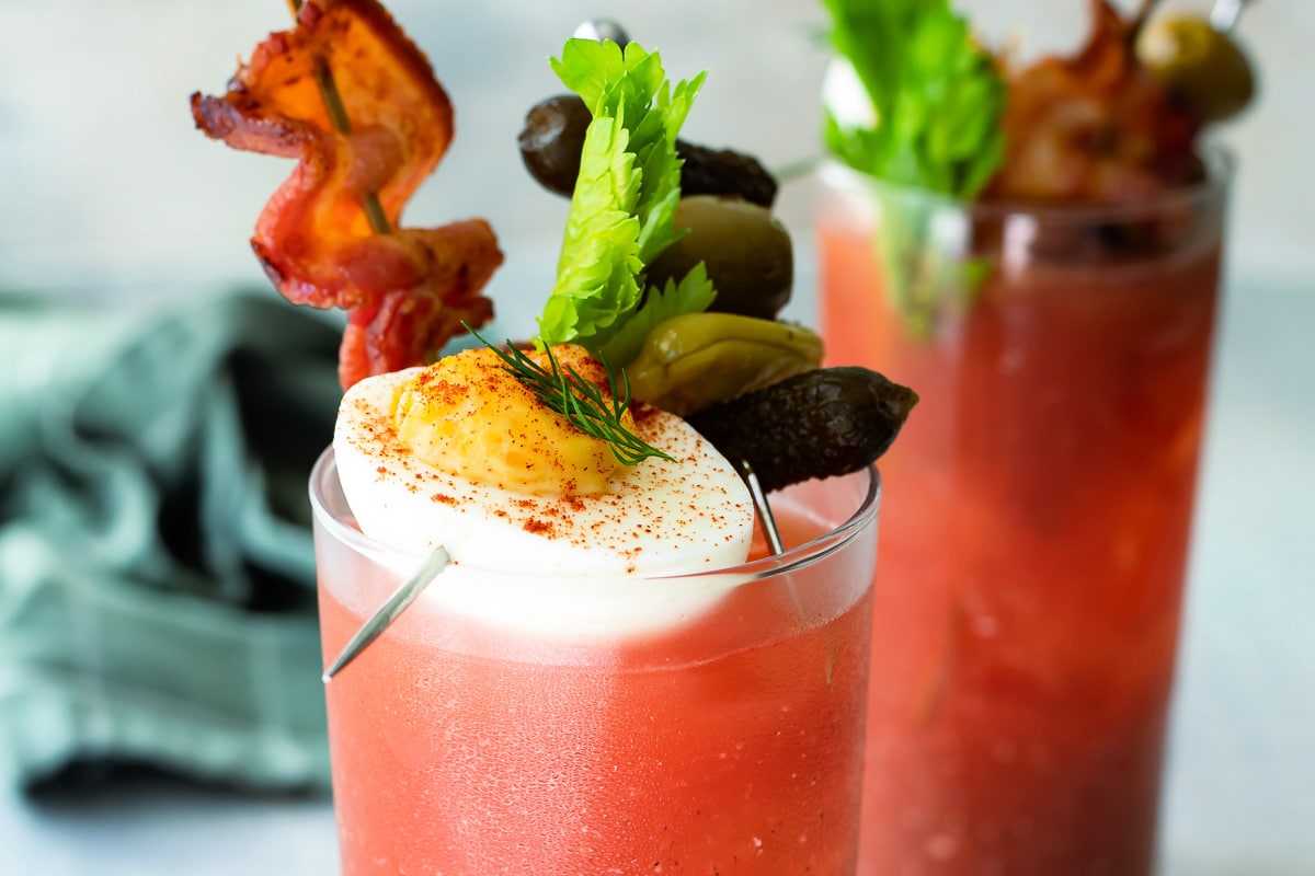Two bloody mary cocktails.