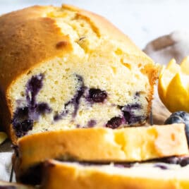 Slices of blueberry lemon yogurt cake on a baking rack.