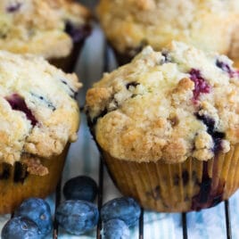 Blueberry muffins on a cooling rack.