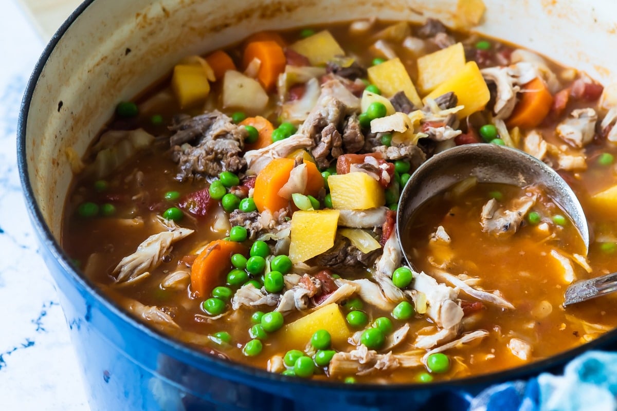 Booyah stew in a blue Dutch oven.