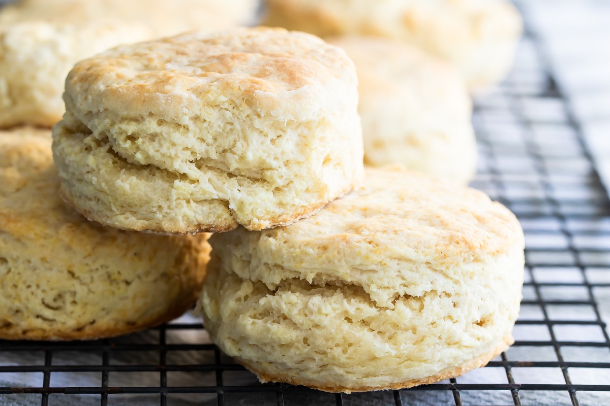 Buttermilk biscuits on a baking rack.