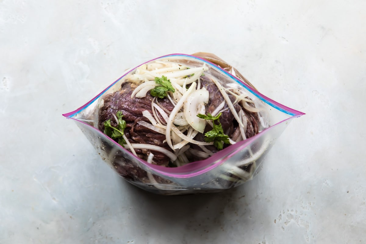 Carne Asada marinating in a zipper bag.
