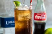 A Charro Negro cocktail in a highball glass.