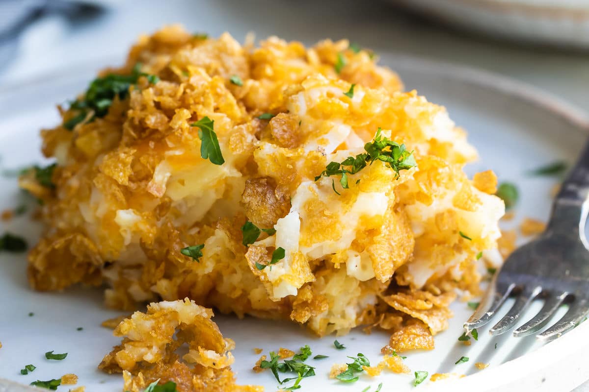 A pile of cheesy potato casserole on a plate.