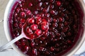 Cooking cherry pie filling in a large stock pot.