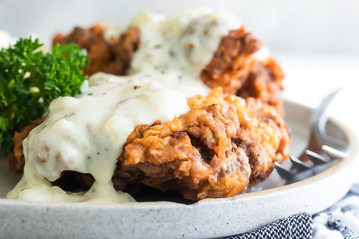 Chicken fried steak on a platter.