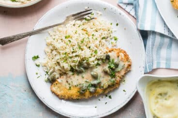 Plates of Chicken Piccata with Lemon Rice Pilaf.