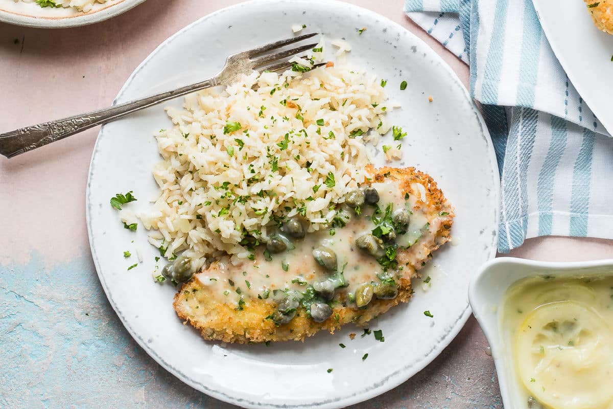 Plates of Chicken Piccata with Lemon Rice Pilaf.