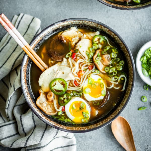 Chicken ramen in a bowl with chopsticks.