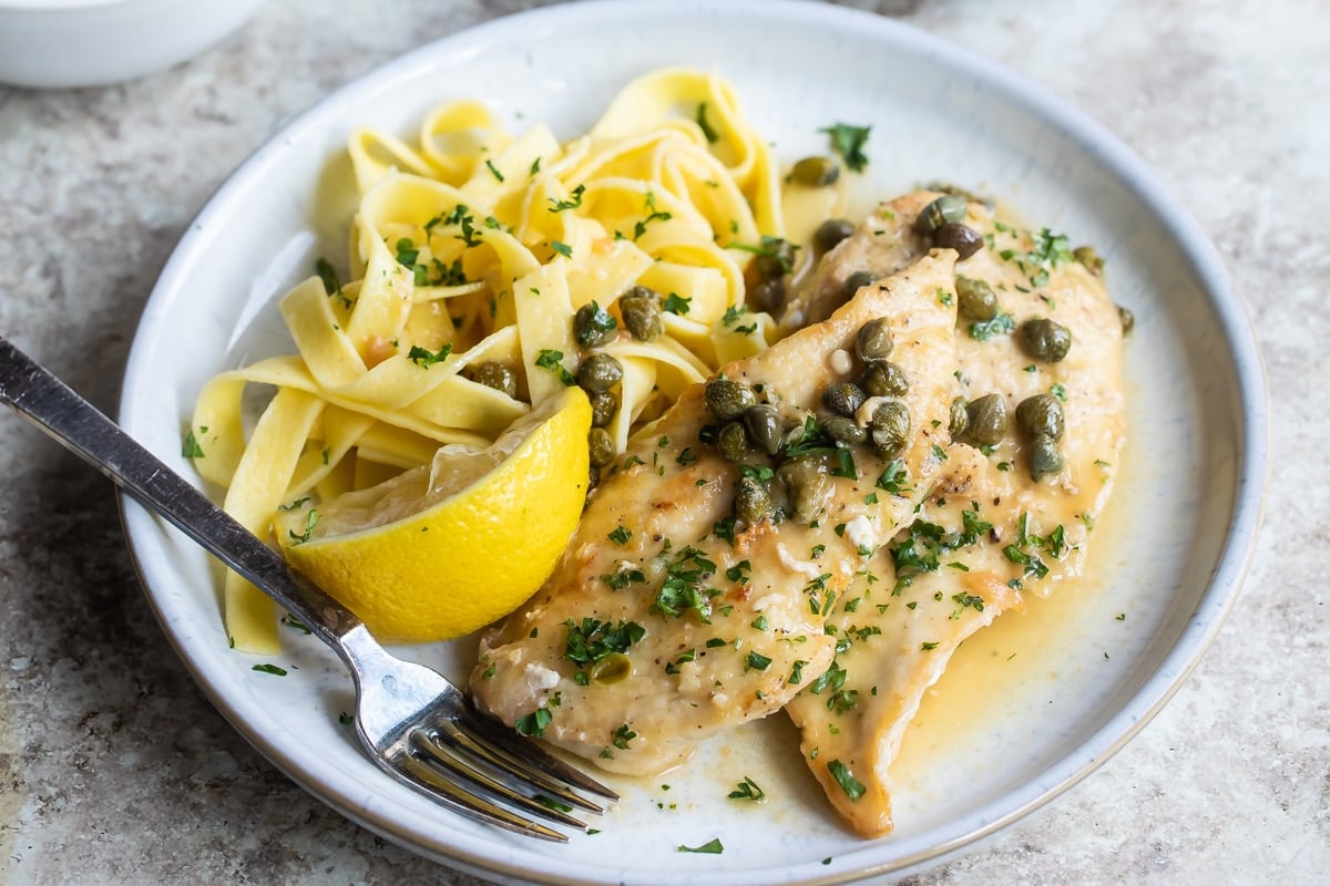 A plate of chicken scallopini.
