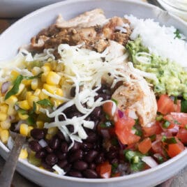 A chipotle burrito bowl in a white bowl.