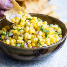 Chipotle corn salsa in a black bowl.