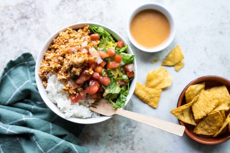 Chipotle sofritas in a white bowl with rice.