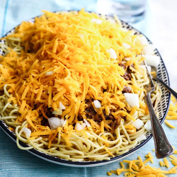 Cincinnati chili in a black and white serving dish.