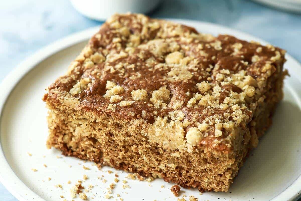 A piece of coffee cake on a small plate.