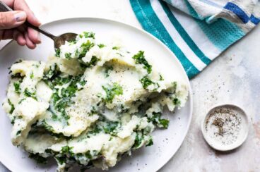 Colcannon on a white serving platter.