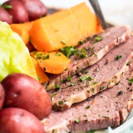 Corned beef, cabbage and potatoes on a round platter.