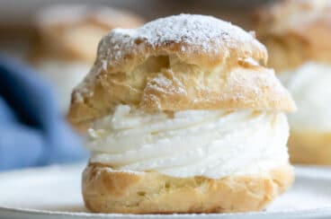 A cream puff on a plate.