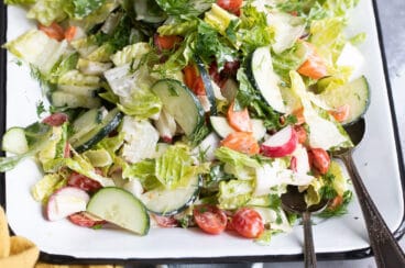 Easy garden salad on a white platter.