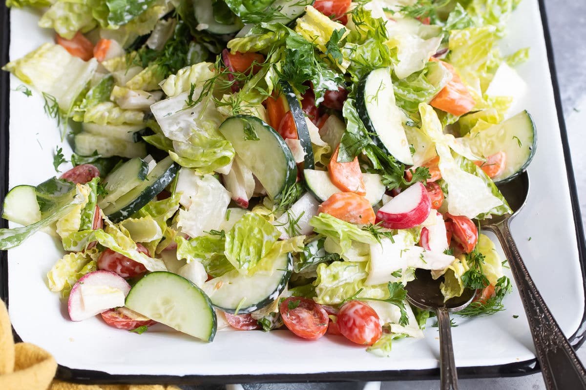 Easy garden salad on a white platter.
