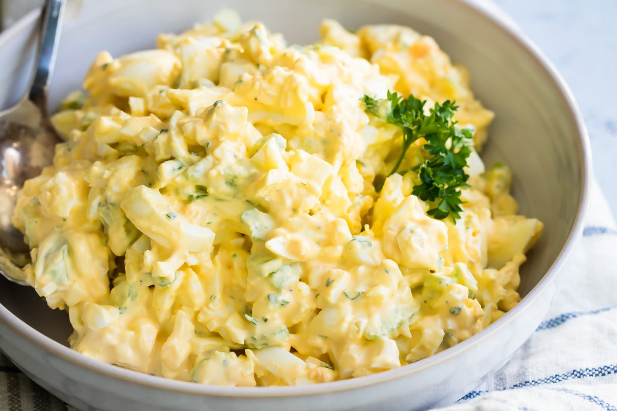 Egg salad in a white serving bowl.
