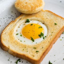 An egg cooked into a piece of bread.
