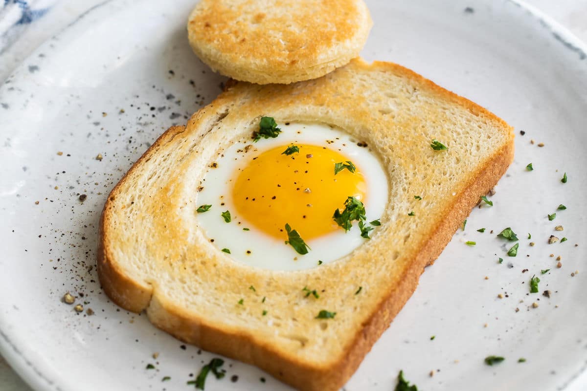 An egg cooked into a piece of bread.