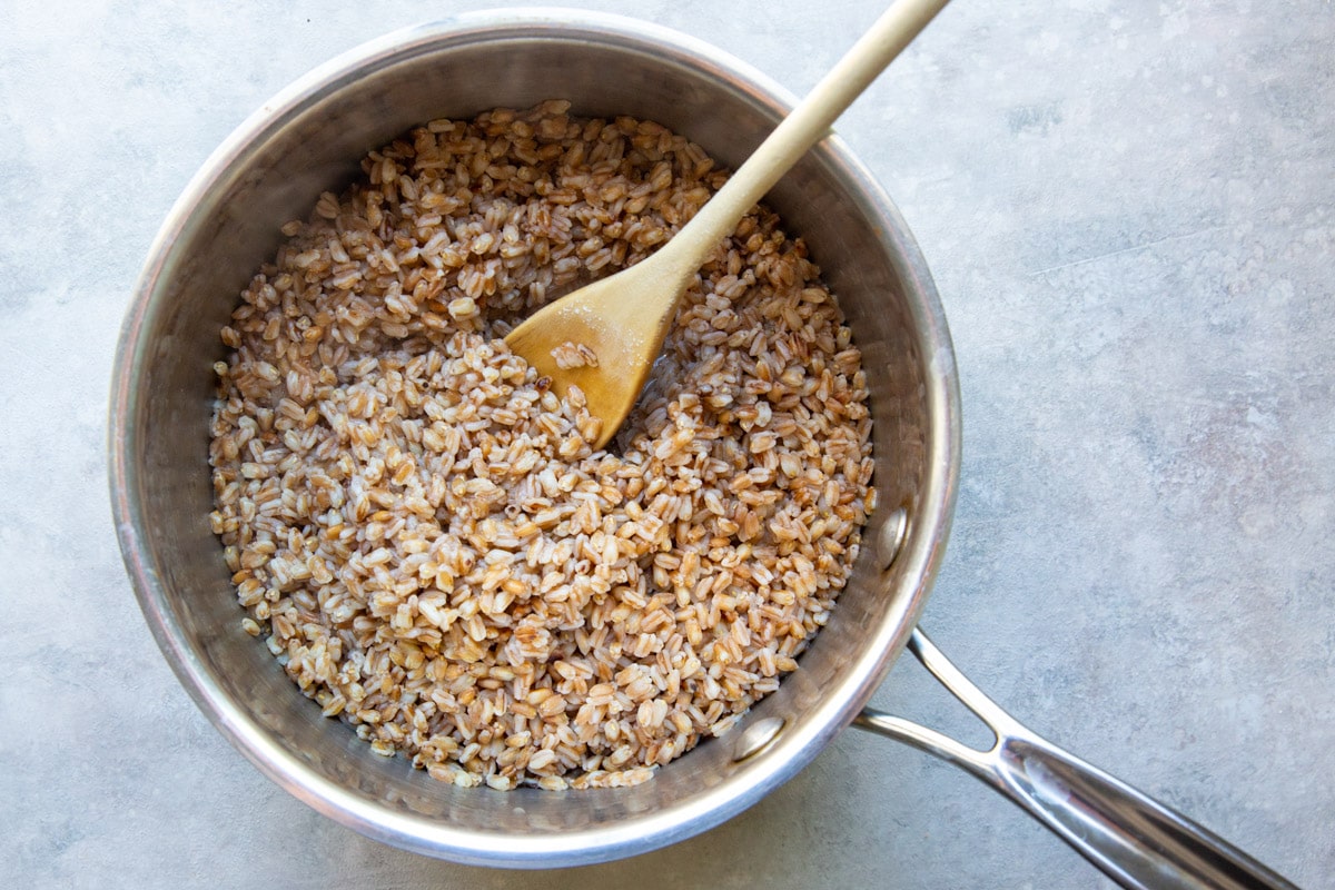 Cooking farro in a saucepan.