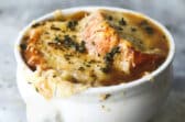 French onion soup in a white bowl.