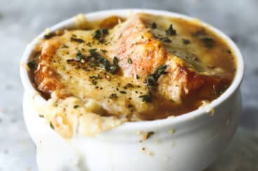 French onion soup in a white bowl.