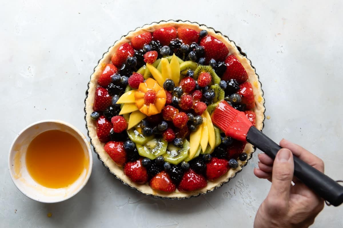 A whole, unsliced fresh fruit tart.