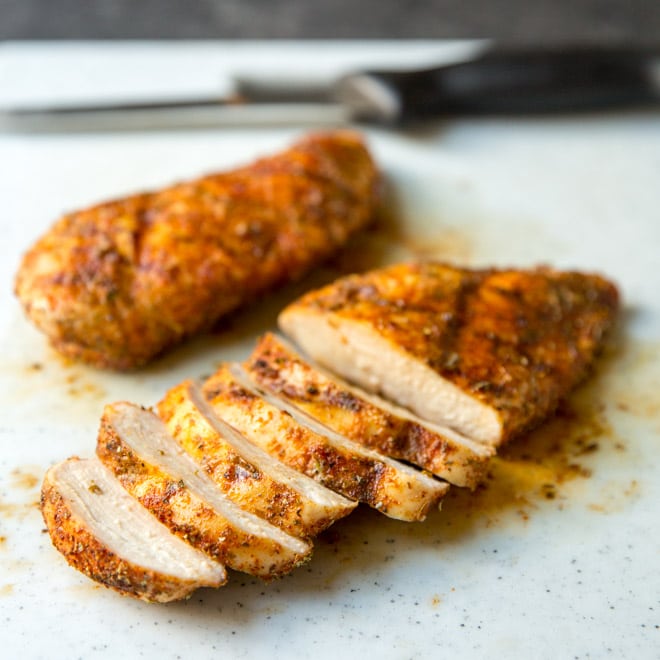 Sliced grilled chicken with rub.