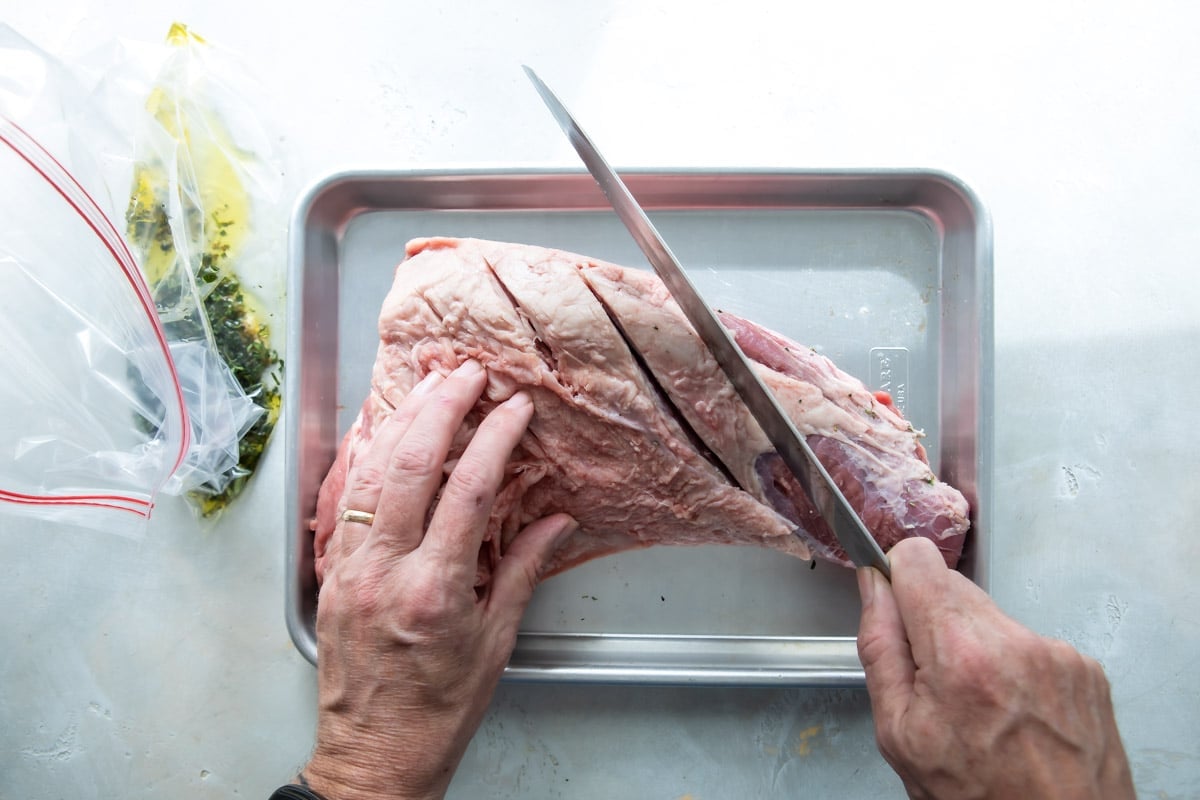 Slicing in to the fat cap of a tri-tip roast.