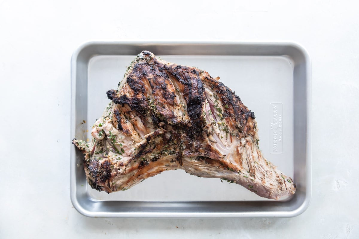A tri-tip roast on a baking sheet.