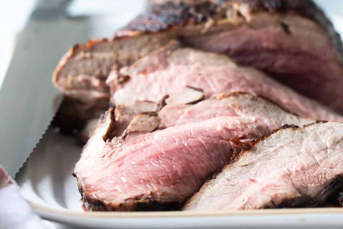 A tri-tip roast with half the meat sliced off.