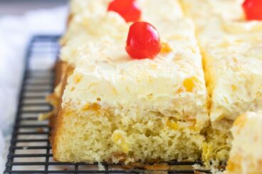 Hawaiian wedding cake slices on a cooling rack.