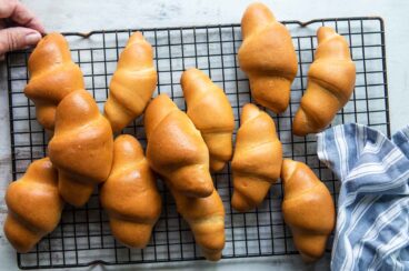 Crescent rolls on a cooling rack.
