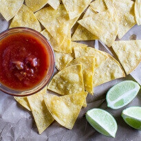 Bake your own Homemade Tortilla Chips in 10 minutes! Extra thin tortillas ensure crunchy snacks every time, perfect for salsa and guacamole.