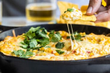 A skillet with hot corn dip.