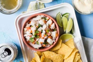 Tilapia ceviche in a bowl with chips.